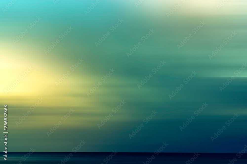 Abstract summer background with the setting sun over the sea.