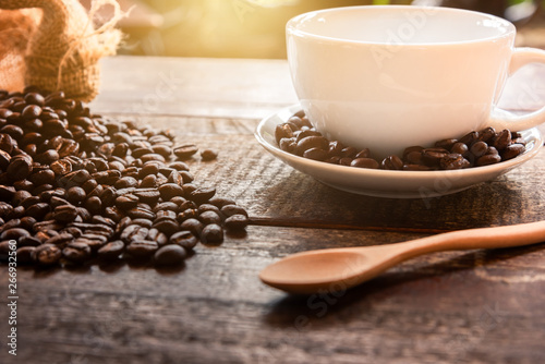 Coffee in a cup on a wooden table, 