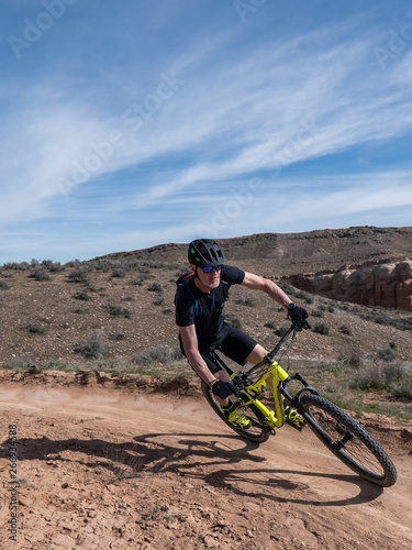 Active senior mountain bikes on single track in Fruita, Colorado
