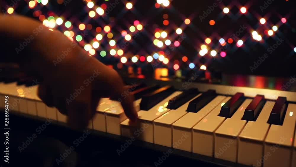 Hands playing the synthesizer close-up, nightlife. Keyboard Musical Instruments, Electronic Music.