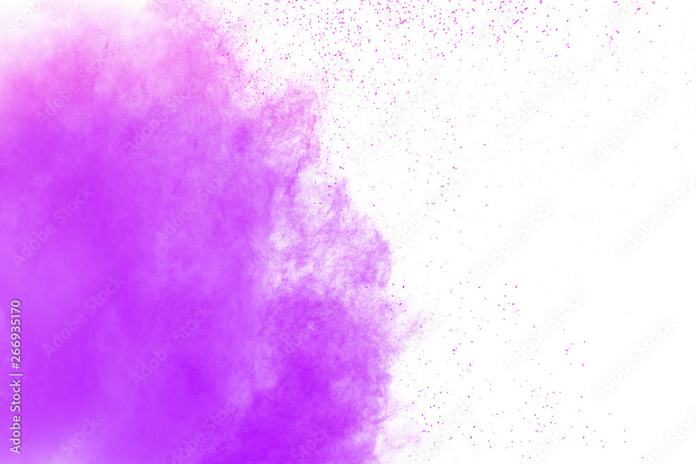 Purple color powder explosion cloud on white background.Closeup of Purple dust particles splash on background.