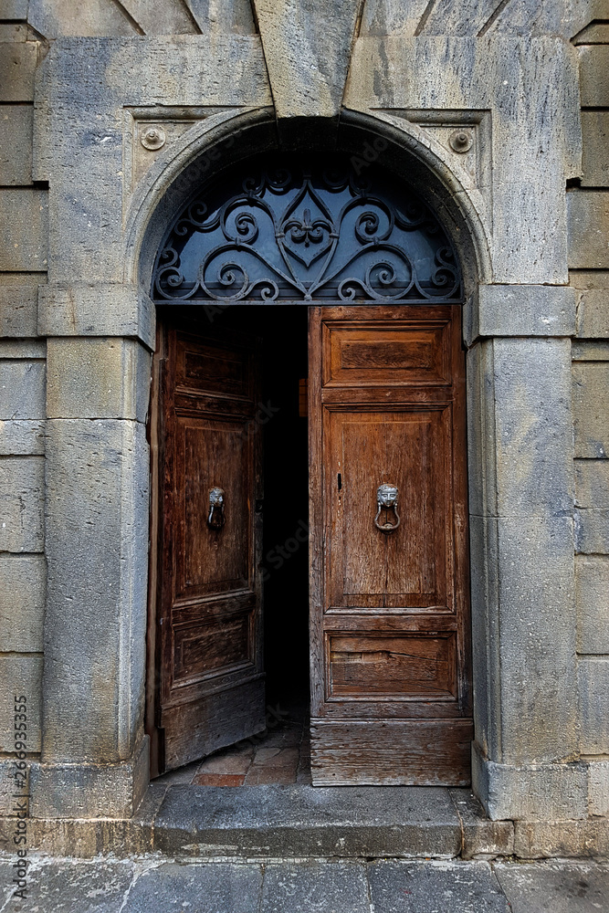 Open antique door in classic Italian style.