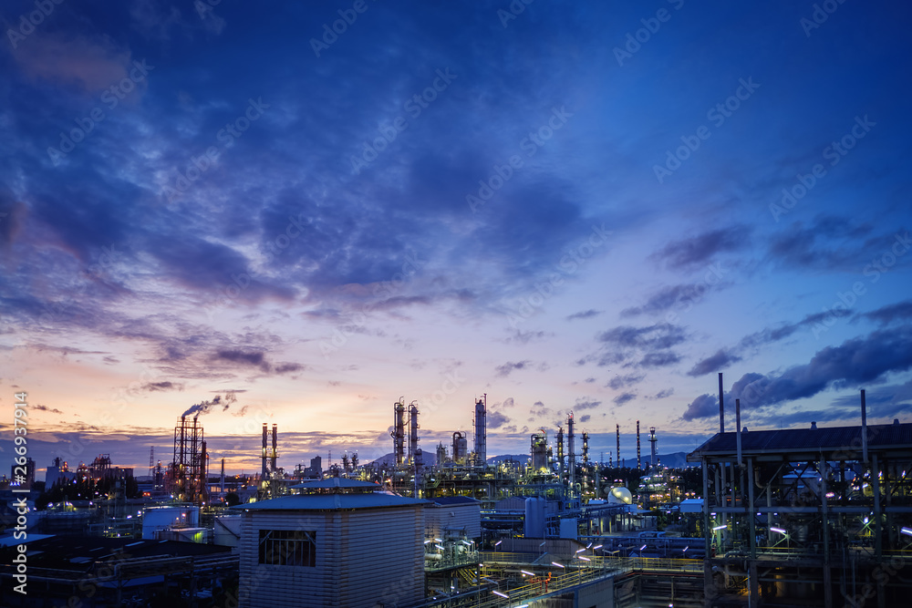 Petrochemical industrial estate on sunset sky background, Factory of oil and gas refinery plant at twilight