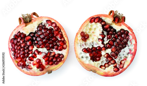 Ripe pomegranate broken into two halves on a white. The form of the top.