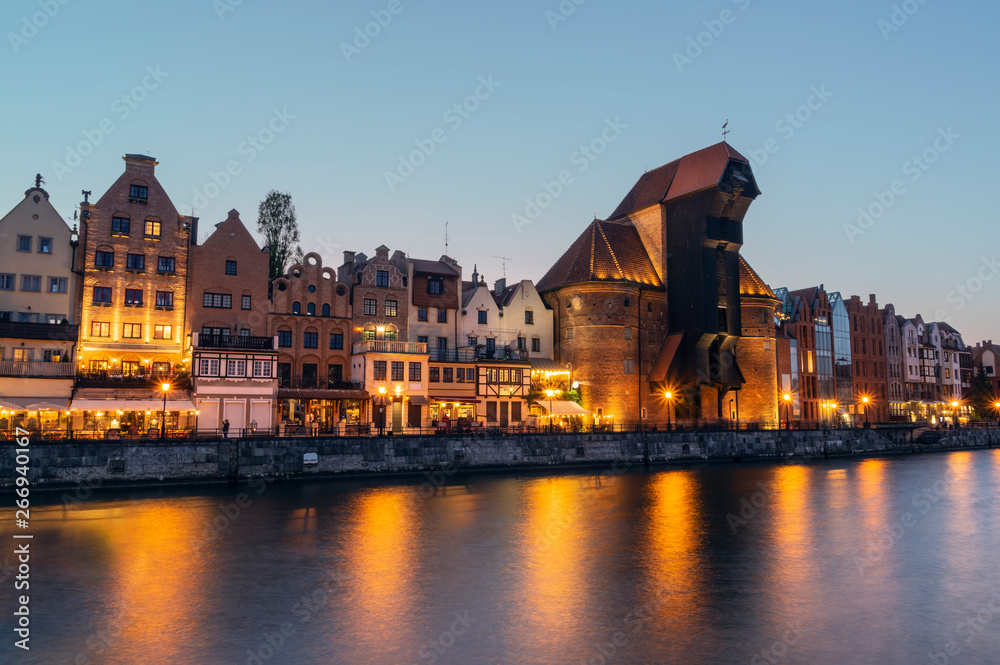 Old town of Gdansk on bank of Motlawa River at dusk