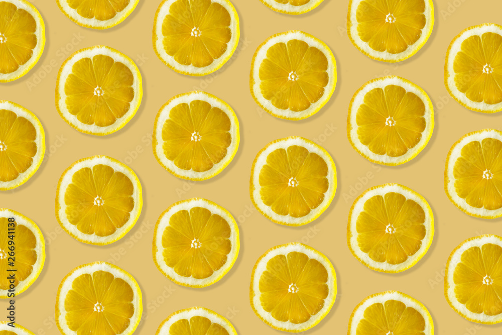 Creative pattern made of lemon. top view of fruit fresh limes slices on orange & yellow colorful background. Creative pattern made of lemon. top view of fruit fresh limes slices on orange & yellow colorful background.