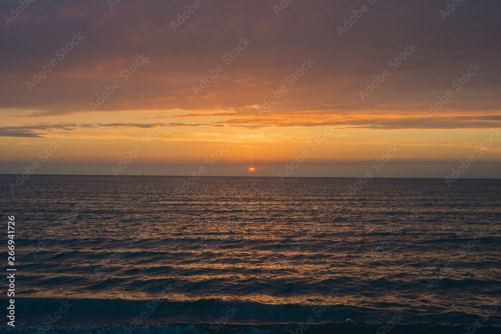 Beautiful sunset over the sea. Bright sunset sky with clouds. Black sea, Anapa, Krasnodar region, Russia Beautiful sunset over the sea. Bright sunset sky with clouds. Black sea, Anapa, Krasnodar region, Russia