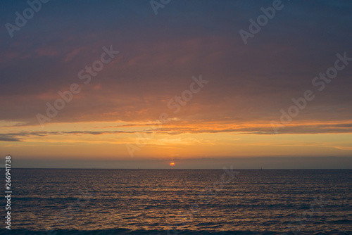 Beautiful sunset over the sea. Bright sunset sky with clouds. Black sea, Anapa, Krasnodar region, Russia