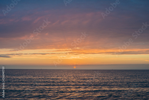 Beautiful sunset over the sea. Bright sunset sky with clouds. Black sea, Anapa, Krasnodar region, Russia