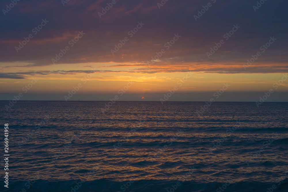Beautiful sunset over the sea. Bright sunset sky with clouds. Black sea, Anapa, Krasnodar region, Russia