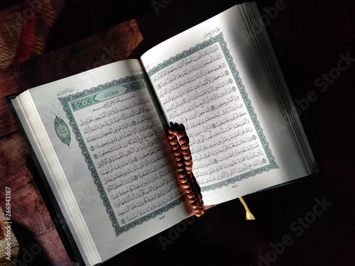 Quran islamic holy book and rosary beads