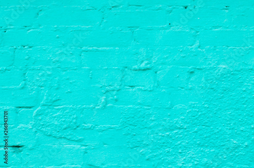 Background of brick wall painted in turquoise. © freeman83