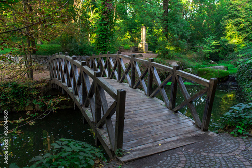 park in Uman city, old wooden bridge over the pond