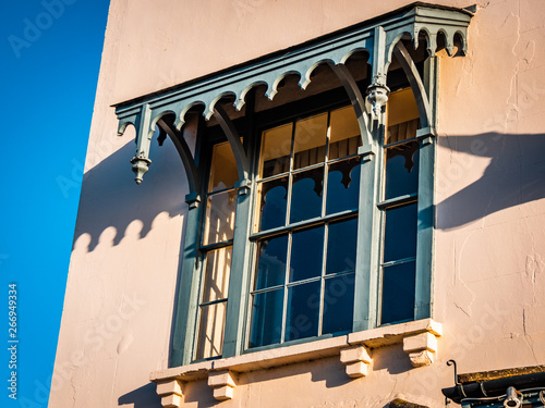 Old house with decorative window frame photo