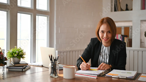 Photos Businesswomen working on office workplace.