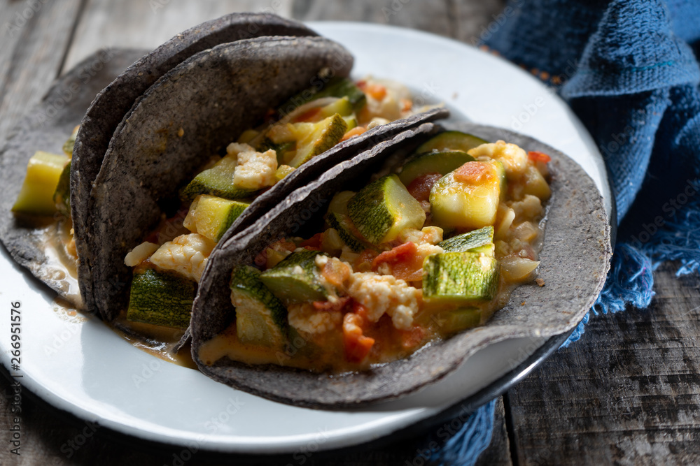 Mexican zucchini stew tacos with blue tortilla Mexican zucchini stew tacos with blue tortilla
