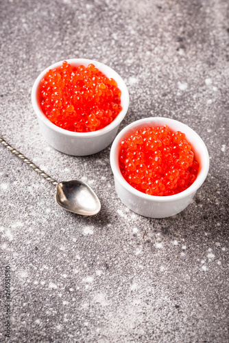 Two bowls with red salmon caviar
