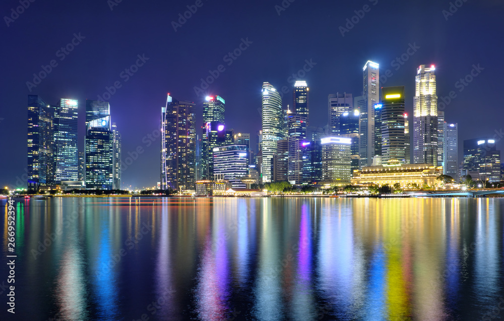 Panorama view of Singapore city skyline at night . Travel asia concept .