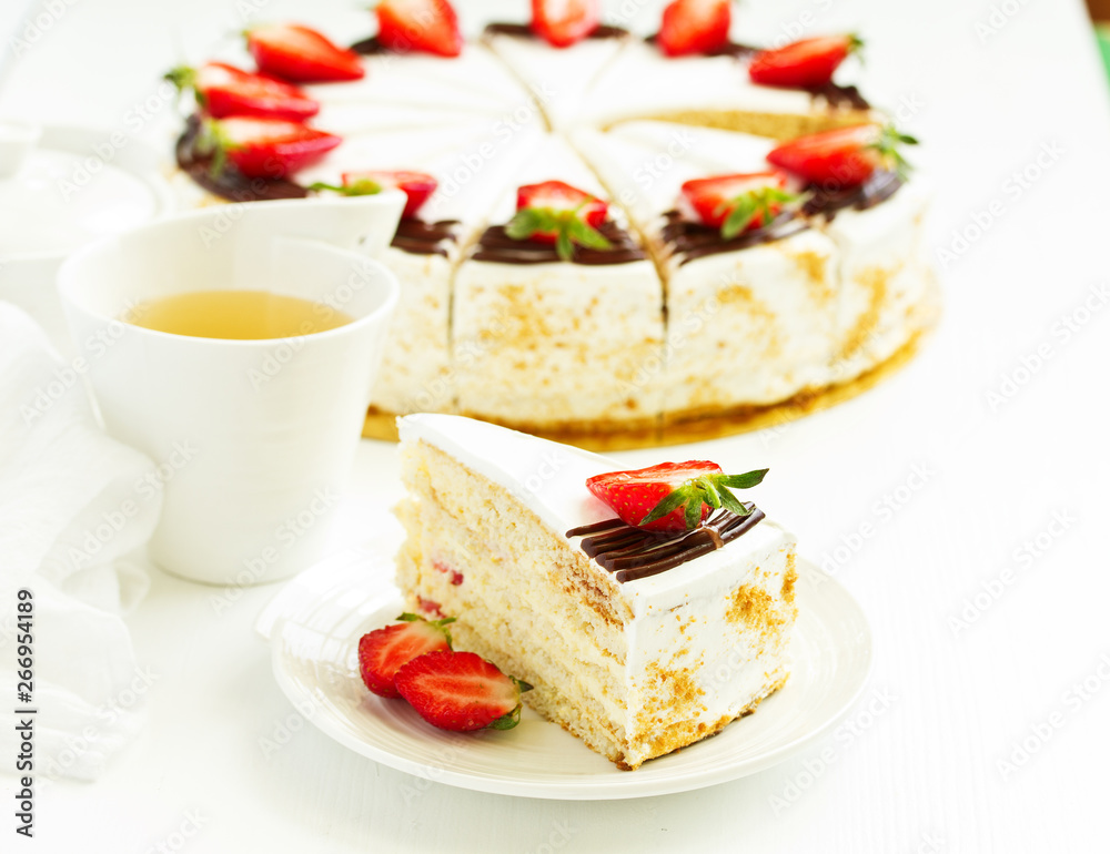 Sponge cake with strawberries and cream. Selective focus. Sponge cake with strawberries and cream. Selective focus.