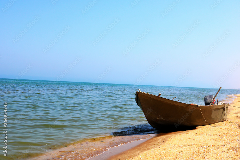 Fishing boat on the sand beach. Old boat on beach. Fishing boat on the sand beach. Old boat on beach.