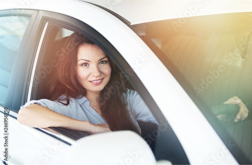 Happy woman with car dealer in auto show or salon © BillionPhotos.com
