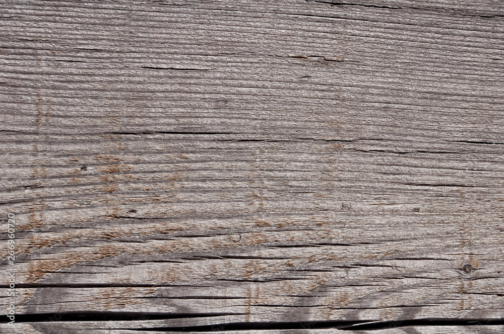 Texture photo of grey, worn, shabby, old and cracked wood which was exposed to weather and sun for years. Ideal as a background Texture photo of grey, worn, shabby, old and cracked wood which was exposed to weather and sun for years. Ideal as a background