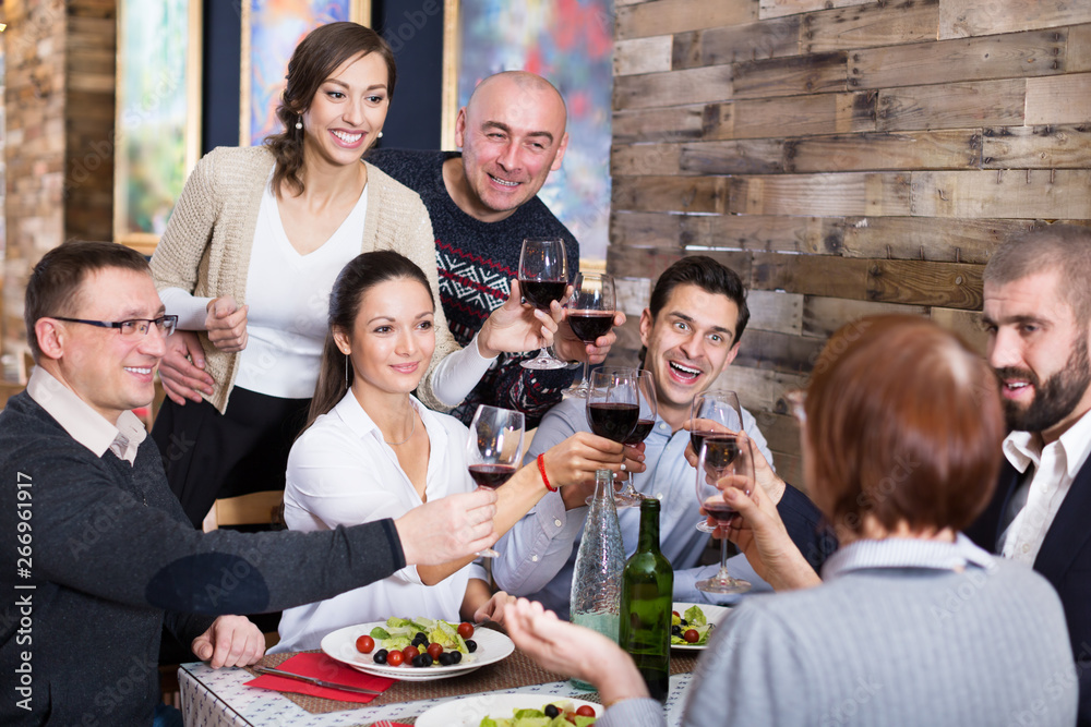 Company men and women in the restaurant