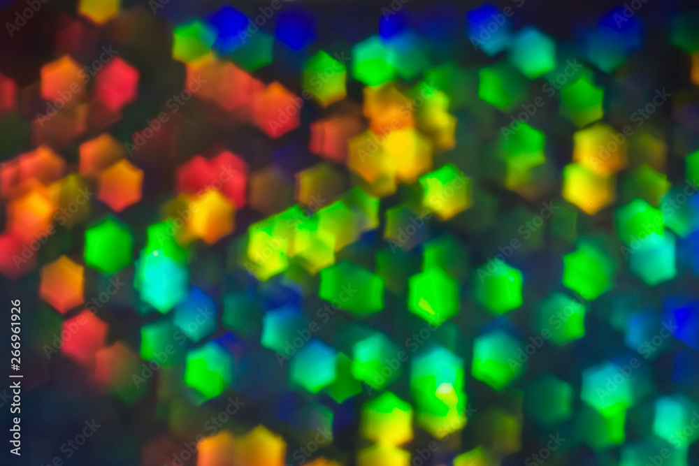 Bokeh, abstract colorful background of defocused hexagon stars.
