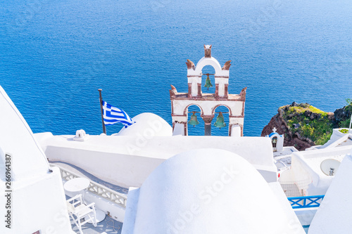 Traditional old Bell Tower against blue sea in Oia, Santorini, Greece