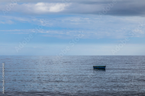 Lonely fishing boat on the ocean