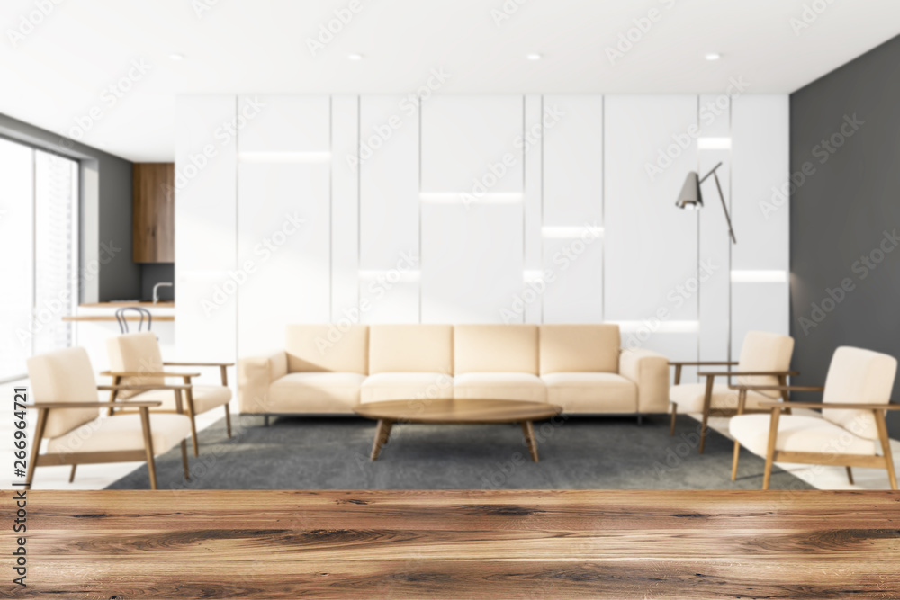 Fototapeta premium White living room with kitchen and armchairs blur