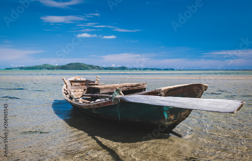 Fishery wooden boat at the shore.