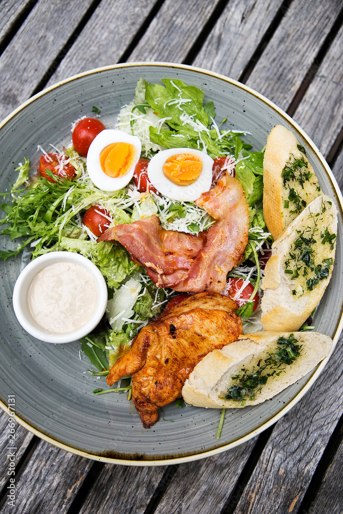 Chicken ceasar salad. Chicken, pancetta, eggs, tomatoes with garlic bread with caesar sauce. Chicken ceasar salad. Chicken, pancetta, eggs, tomatoes with garlic bread with caesar sauce.