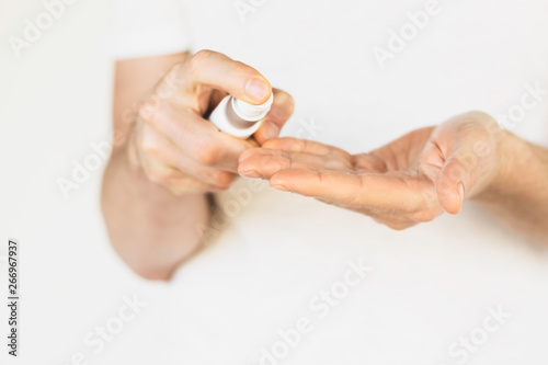 a man takes care of the skin of the hands, apply the cream on the hands