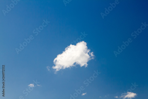 white clouds against the blue sky. Sunny day.