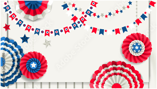 Patriotic banner with paper pinwheels hanging on wooden fence
