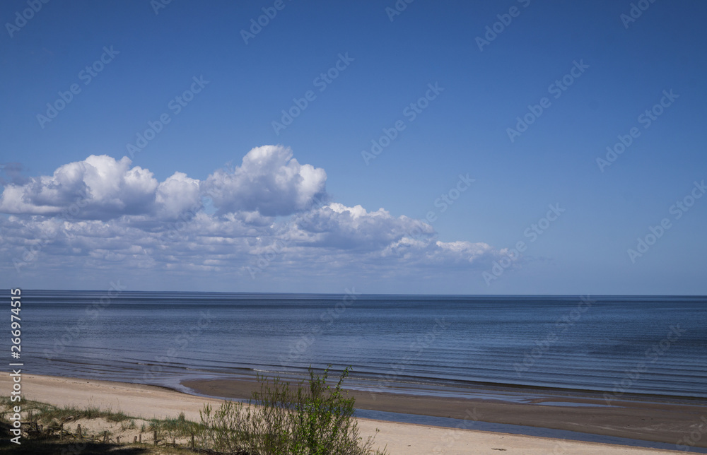 Beautiful view of the Gulf of Riga in the early spring. The sea is calm.