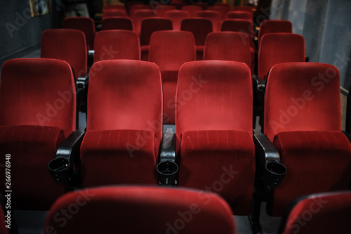 close up photo of rows of red seats in the cinema/theatre/concert hallcinema