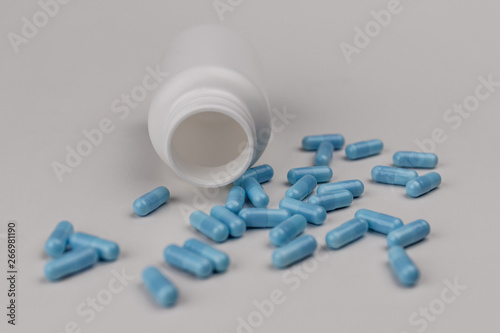 Close up view of generic blue pills. Opiate and heroin overdoses have skyrocketed in recent years IV photo