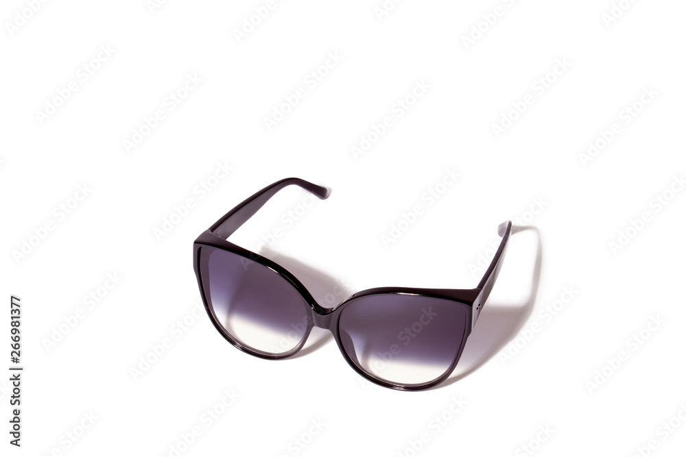 Trendy cat eye dark gradient sunglasses in fine black plastic frame. Trendy cat eye dark gradient sunglasses in fine black plastic frame.