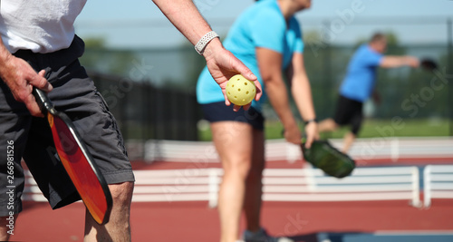 Pickleball is played outdoors