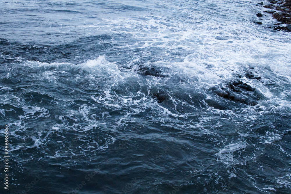 Fototapeta premium Dark blue nothern ocean waves in winter. Water surface