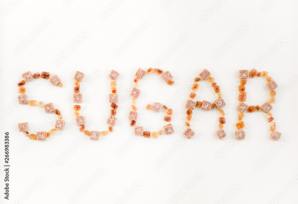 SUGAR written with brown sugar pieces