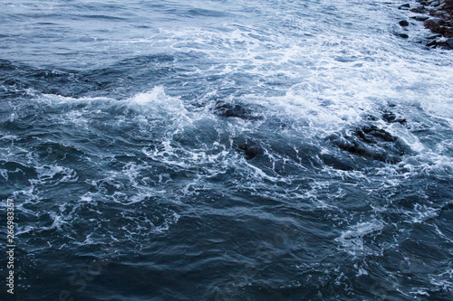 Dark blue nothern ocean waves in winter. Water surface © erosch