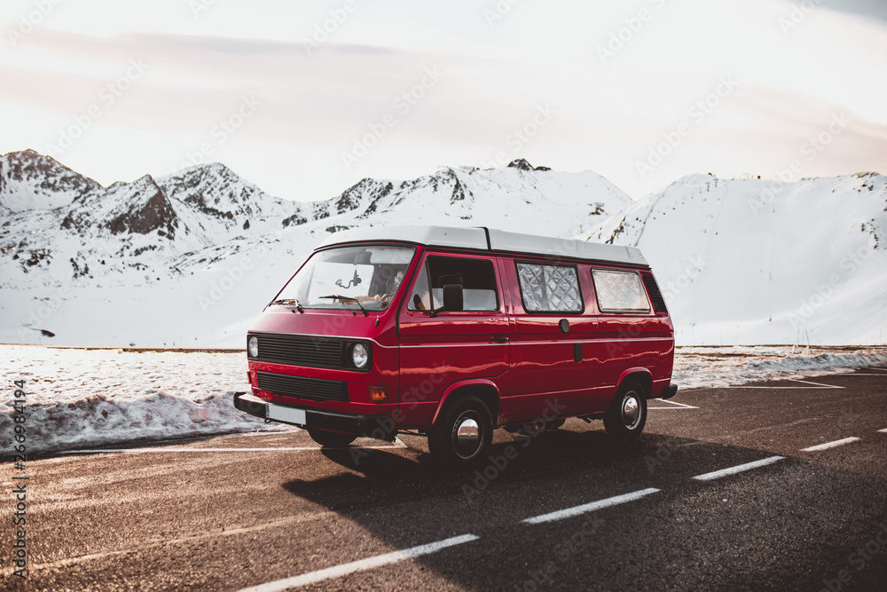 Red caravan riding near snowy mountains Red caravan riding near snowy mountains