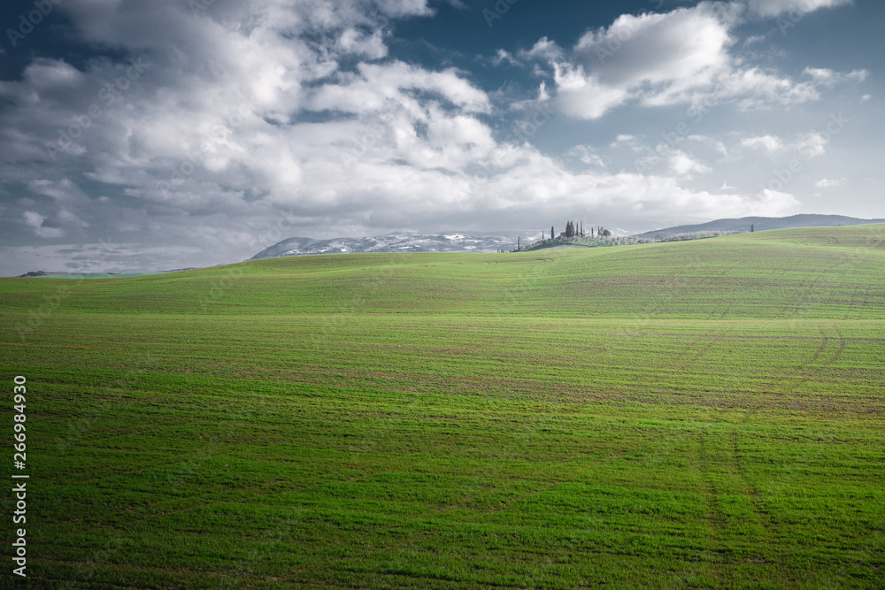 Panoramic view of beautiful endless green fields in bright sunlight, Italy Panoramic view of beautiful endless green fields in bright sunlight, Italy
