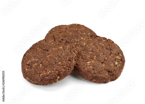 Round chocolate whole wheat biscuit, cookie with raisins isolated on white background. Chocolate Biscuits with whole-wheat (wholemeal) flour isolated on white background 