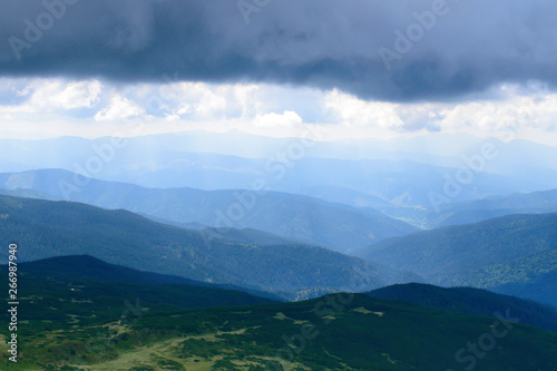 Panoramic view on thunderstorm clouds from Hoverla  Carpathian mountains  Ukraine. Horizontal outdoors shot