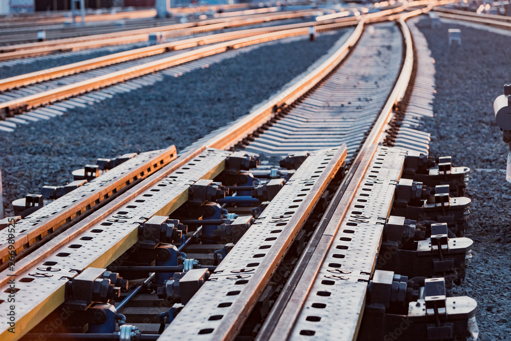 Wagon retarders. Device for slowing down rail cars. Sorting hill. Railway in the rays of the setting backlight illumination. Wagon retarders. Device for slowing down rail cars. Sorting hill. Railway in the rays of the setting backlight illumination.