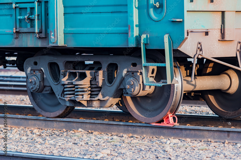 Railway carriage stands on the rails. Wagon wheels. Rails.